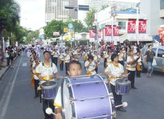 Marching bands march down Beach Road trying to be the best of the Thailand International Marching Band Competition.